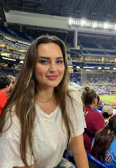 Alexandra Berggren in the stands at a baseball game | Female fitness influencers