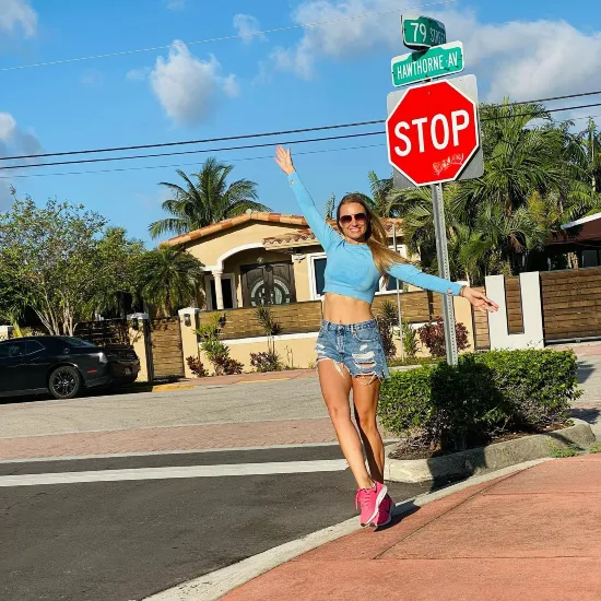 Anfisa Penkin balancing on the curb | Stop sign on Hawthorne avenue