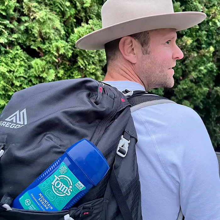 Backpacking with hat promoting mountain spring deodorant