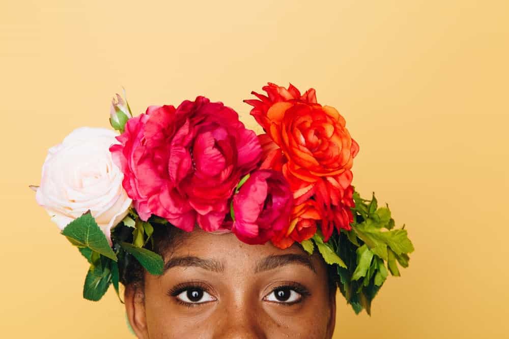 An influencef with a flower bouquet on her head | Token Representation with Influencers