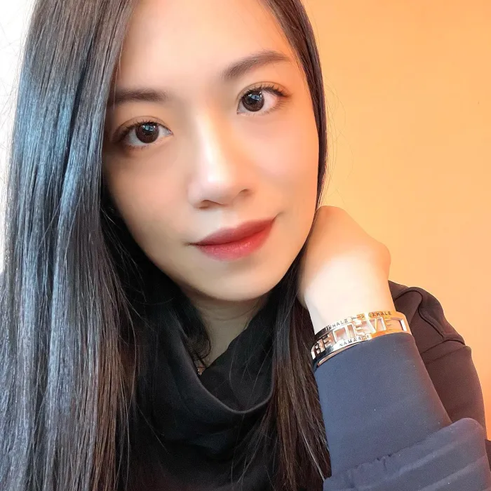 Cecilia Wang showing off her shiny mantra bracelet