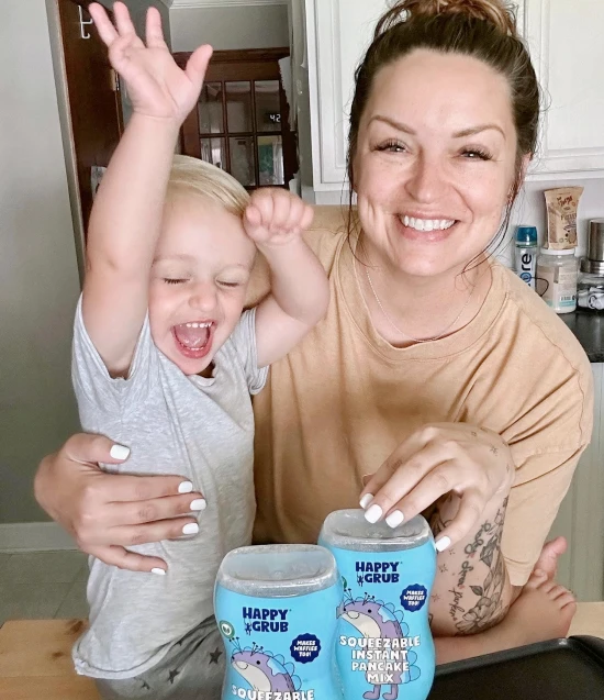 Danielle McCormick with her son promoting Happy Grub's pancake mix